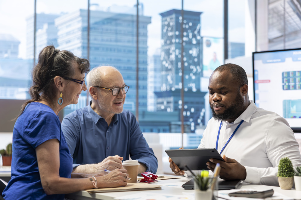 Business team meeting with advisor in modern office